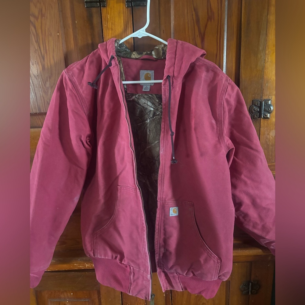 Pink Carhartt jacket with camo lining size Medium 8-10